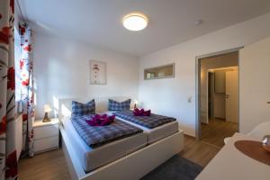 Ένα ή περισσότερα κρεβάτια σε δωμάτιο στο FeWo-Prerow