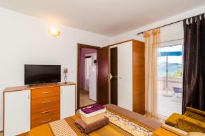 TV a/nebo společenská místnost v ubytování Apartment Bay of Dreams