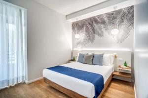 Łóżko lub łóżka w pokoju w obiekcie Victor Boutique Hotel