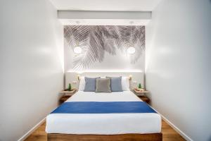 Łóżko lub łóżka w pokoju w obiekcie Victor Boutique Hotel