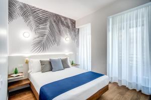 Łóżko lub łóżka w pokoju w obiekcie Victor Boutique Hotel
