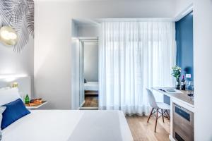 Łóżko lub łóżka w pokoju w obiekcie Victor Boutique Hotel