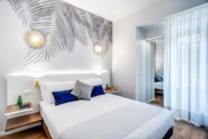 Łóżko lub łóżka w pokoju w obiekcie Victor Boutique Hotel
