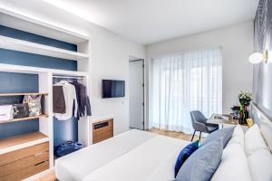 Łóżko lub łóżka w pokoju w obiekcie Victor Boutique Hotel