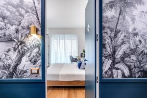 Łóżko lub łóżka w pokoju w obiekcie Victor Boutique Hotel