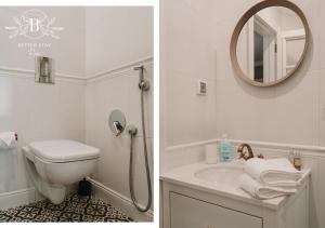a bathroom with a toilet and a sink and a mirror at Heart of the City - Better Stay Townhouse in Ruse