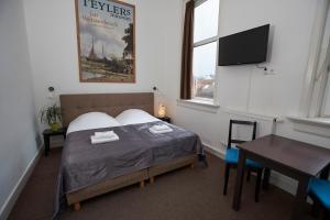 מיטה או מיטות בחדר ב-Bed & Breakfast Hotel Malts