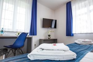 Postel nebo postele na pokoji v ubytování Hotel "Zur Mühle"