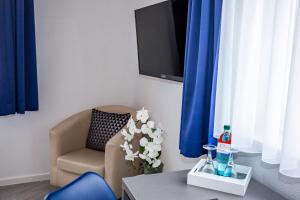 TV a/nebo společenská místnost v ubytování Hotel "Zur Mühle"