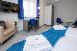 Postel nebo postele na pokoji v ubytování Hotel "Zur Mühle"