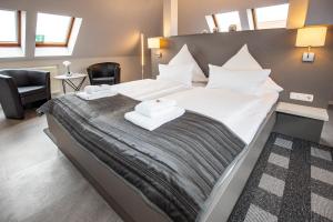 Postel nebo postele na pokoji v ubytování Hotel "Zur Mühle"