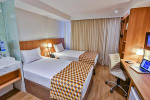 Postel nebo postele na pokoji v ubytování Sleep Inn Aeroporto de Guarulhos - São Paulo