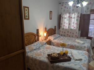 Postel nebo postele na pokoji v ubytování Hostal Moraima