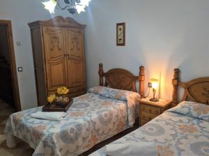 Postel nebo postele na pokoji v ubytování Hostal Moraima