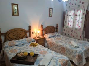 Postel nebo postele na pokoji v ubytování Hostal Moraima