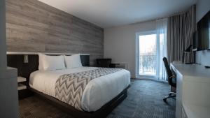 Postel nebo postele na pokoji v ubytování Hôtel Le Francis