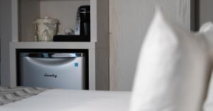 Postel nebo postele na pokoji v ubytování Hôtel Le Francis
