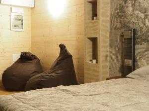 a bedroom with a bed with a blanket on it at VIRASOL IN CITTÁ, camera NUVOLE in Cuneo