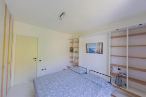 a bedroom with a bed and a closet at Residence Villa Ada Holiday C208 in Ghiffa +13 photos