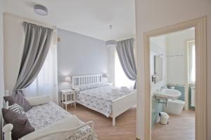 Postel nebo postele na pokoji v ubytování Il canto delle Sirene