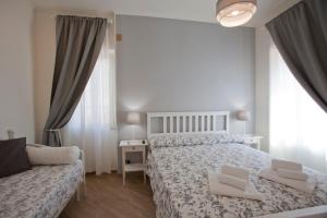 Postel nebo postele na pokoji v ubytování Il canto delle Sirene