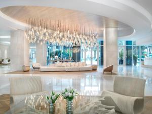 a large lobby with a chandelier in a building at Grand Beach Hotel Surfside in Miami Beach