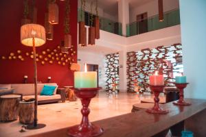 a lobby with candles on a table in a room at Hotel Unión Plaza in Montería