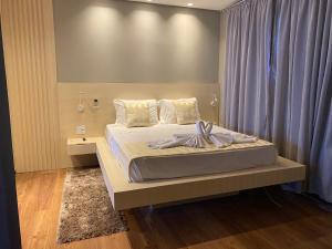 Ένα ή περισσότερα κρεβάτια σε δωμάτιο στο Mayná Hotel Prudentópolis Centro