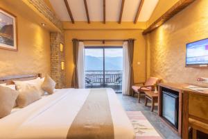 Ένα ή περισσότερα κρεβάτια σε δωμάτιο στο Bar Peepal Resort