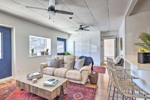 a living room with a couch and a table at Renovated Dtwn Retreat Less Than 1 Mi to Plaza Park! in San Marcos