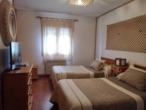 En eller flere senger på et rom på Casa Rural Castellanos