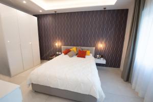 Łóżko lub łóżka w pokoju w obiekcie Napoli City Center - Appartamenti e Camere