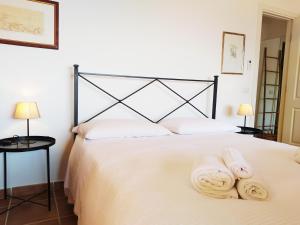 A bed or beds in a room at Villa Vittorio - Splendid panoramic sea view terrace