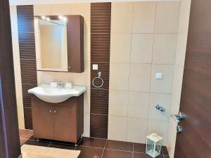 a bathroom with a sink and a shower with a mirror at Bel Air in Skala Potamias +27 photos