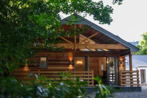 a log cabin with a gambrel roof at Wee Ness Lodge in Inverness