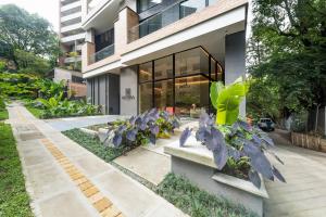 a house with plants in front of it at Lettera Hotel in Medellín