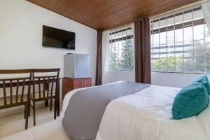 Postel nebo postele na pokoji v ubytování Hotel Calle 112 + 33 fotografií