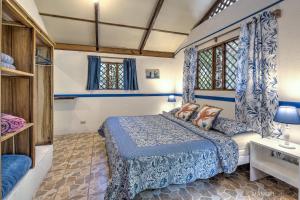Postelja oz. postelje v sobi nastanitve Casa Violeta Beach House in Punta Uva