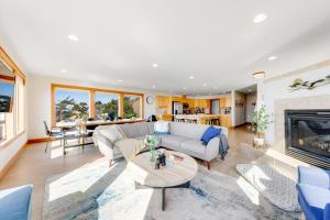a living room with a couch and a fireplace at Blue Wave Heights in Lincoln City