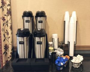a counter top with two water heaters and paper towels at Red Roof Inn & Suites DeKalb in DeKalb