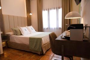Postel nebo postele na pokoji v ubytování Jardines de la Mata Boutique Beach