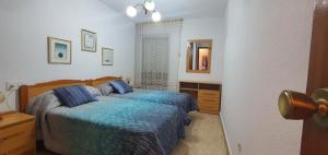 Ένα ή περισσότερα κρεβάτια σε δωμάτιο στο ADELFAS - Fincas Arena +12 φωτογραφίες