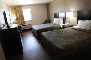 A bed or beds in a room at Econo Inn