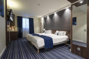 Postel nebo postele na pokoji v ubytování Holiday Inn Express Lille Centre by IHG