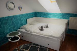 A bed or beds in a room at Podkrovný apartmán Donovaly AD Tatran