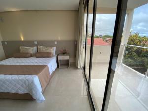 Кровать или кровати в номере Hotel Rio Araguaia Xambioá TO