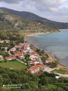 an aerial view of a town next to the beach at Venus Rooms in Katelios