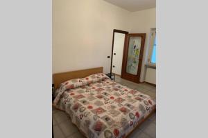 Postel nebo postele na pokoji v ubytování myrooftop a 10 min dalla Reggia di Caserta
