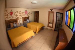 Voodi või voodid majutusasutuse HOTEL CASA LIMON toas