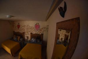 Voodi või voodid majutusasutuse HOTEL CASA LIMON toas
